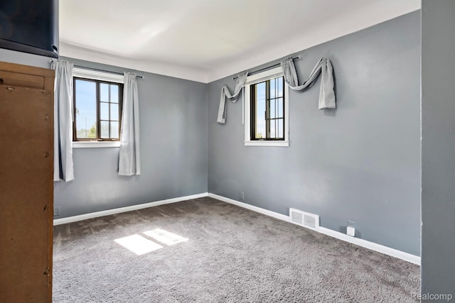5304 E Frances Rd, Mount Morris, MI 48458 - empty room featuring carpet floors, healthy amount of natural light, and baseboards