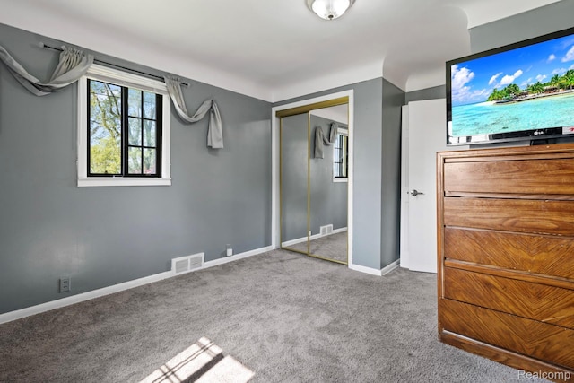 5304 E Frances Rd, Mount Morris, MI 48458 - unfurnished bedroom featuring carpet, baseboards, and a closet