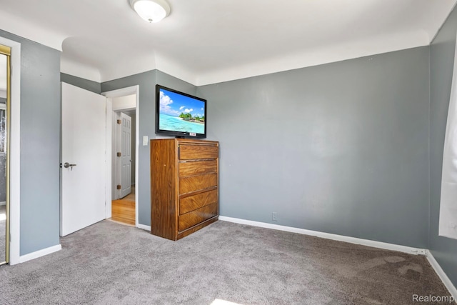 5304 E Frances Rd, Mount Morris, MI 48458 - unfurnished bedroom with carpet floors and baseboards