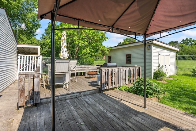 5304 E Frances Rd, Mount Morris, MI 48458 - wooden deck with outdoor dining space and an outbuilding