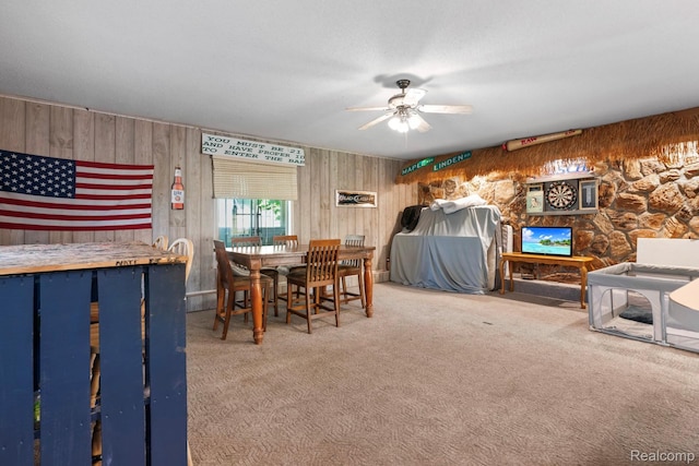 5304 E Frances Rd, Mount Morris, MI 48458 - dining room featuring ceiling fan, carpet flooring, and wooden walls