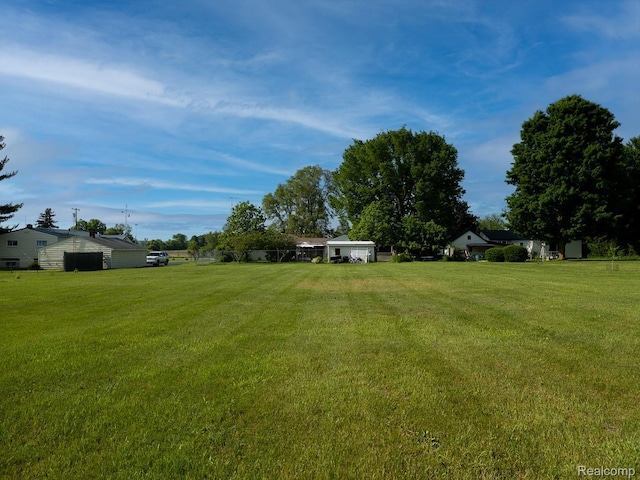 5304 E Frances Rd, Mount Morris, MI 48458 - view of green lawn featuring a garage