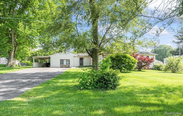 5304 E Frances Rd, Mount Morris, MI 48458 - view of front of home featuring driveway, an attached carport, and a front yard