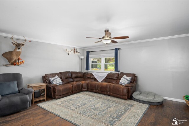 living area with baseboards, a ceiling fan, dark wood-style floors, and ornamental molding