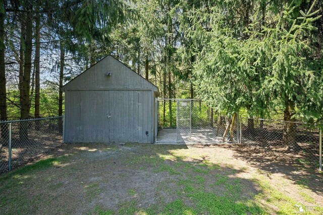view of shed with fence
