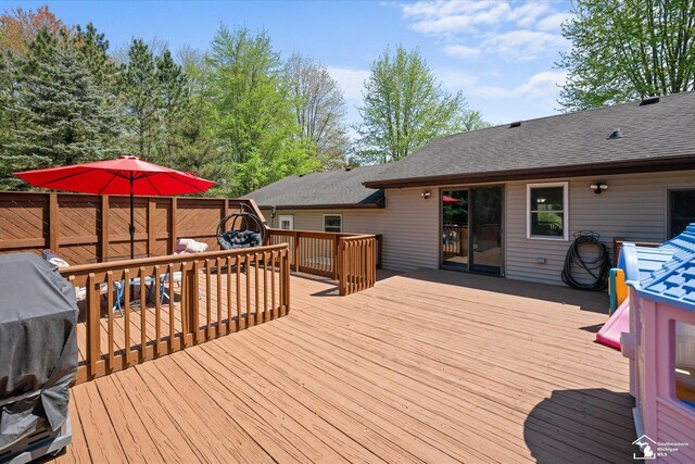 wooden deck featuring area for grilling