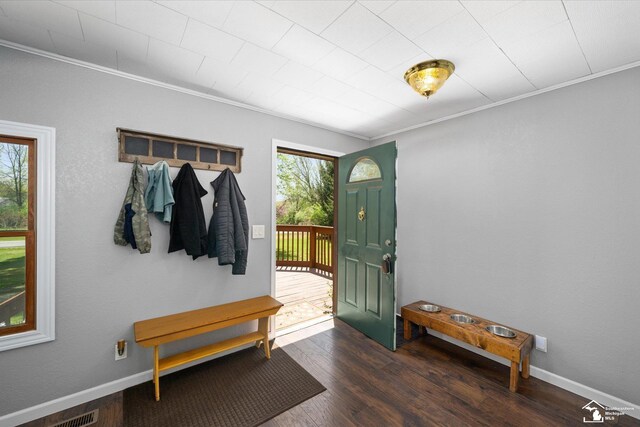 mudroom featuring crown molding, baseboards, and wood finished floors
