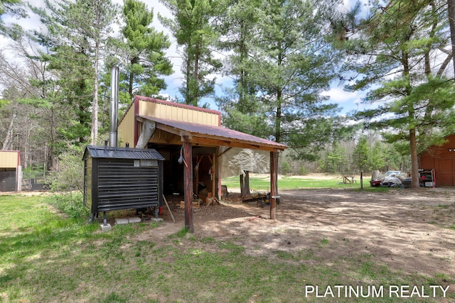 4334 Brunswick Rd, Holton, MI 49425 - view of yard with an outdoor structure and a storage shed