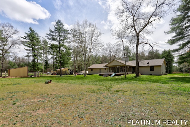 4334 Brunswick Rd, Holton, MI 49425 - view of grassy yard featuring view of wooded area