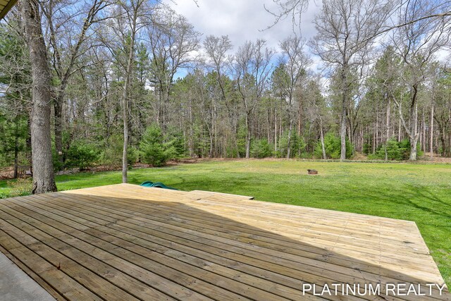 4334 Brunswick Rd, Holton, MI 49425 - deck with a yard