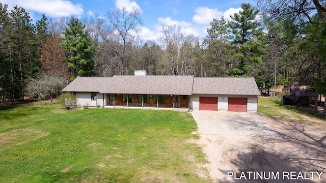 4334 Brunswick Rd, Holton, MI 49425 - ranch-style home with covered porch, a garage, driveway, a front yard, and a chimney