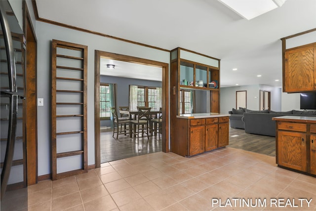 4334 Brunswick Rd, Holton, MI 49425 - kitchen with recessed lighting, open floor plan, light tile patterned flooring, and brown cabinets