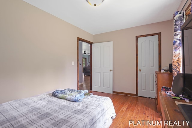 4334 Brunswick Rd, Holton, MI 49425 - bedroom featuring light wood-style floors and baseboards