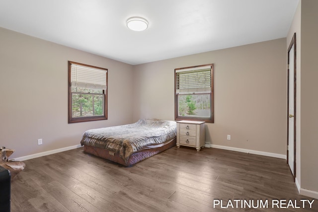 4334 Brunswick Rd, Holton, MI 49425 - bedroom with wood finished floors and baseboards