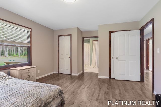 4334 Brunswick Rd, Holton, MI 49425 - bedroom featuring wood finished floors and baseboards