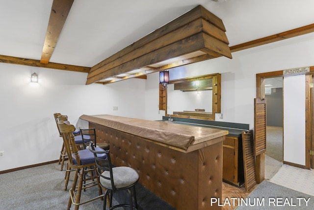 4334 Brunswick Rd, Holton, MI 49425 - indoor dry bar featuring carpet floors, baseboards, and beamed ceiling