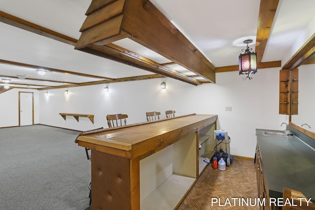 4334 Brunswick Rd, Holton, MI 49425 - kitchen with a sink, baseboards, and decorative light fixtures