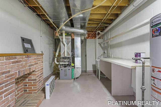 4334 Brunswick Rd, Holton, MI 49425 - unfinished basement featuring heating unit, concrete block wall, and gas water heater