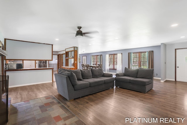 4334 Brunswick Rd, Holton, MI 49425 - living area with ceiling fan, wood finished floors, recessed lighting, and baseboards