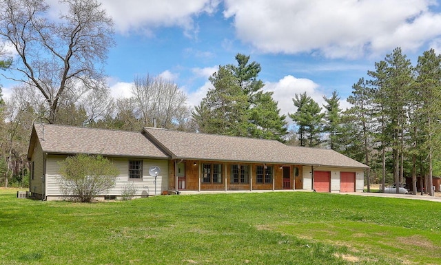 4334 Brunswick Rd, Holton, MI 49425 - single story home featuring covered porch, driveway, a garage, and a front lawn