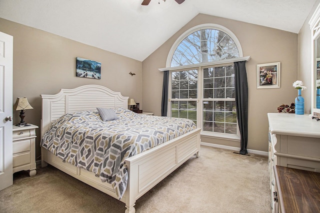 bedroom featuring carpet floors, baseboards, a ceiling fan, and vaulted ceiling
