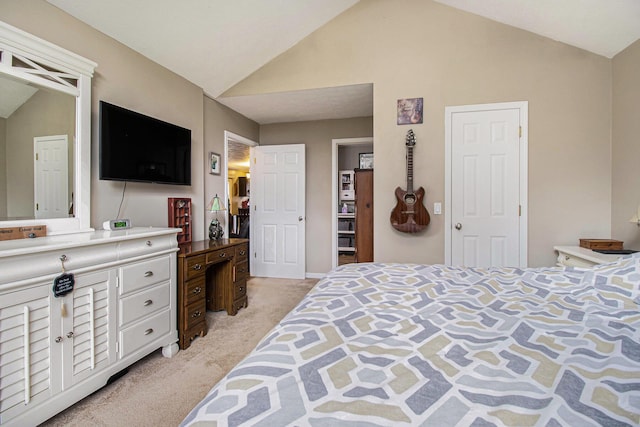 bedroom with light colored carpet and lofted ceiling