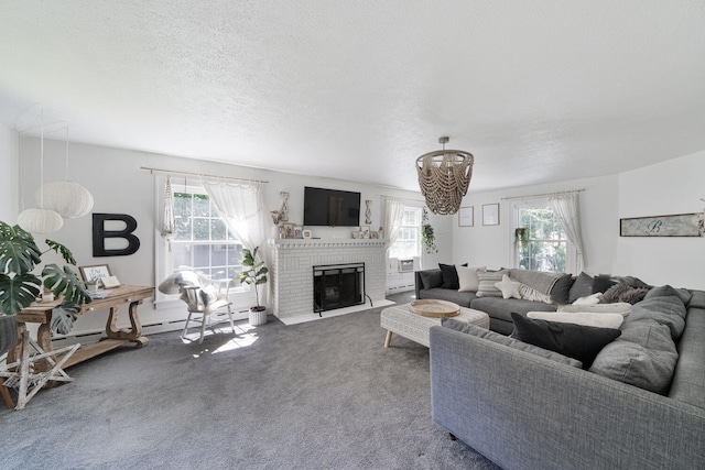 61412 Walnut St, Cassopolis, MI 49031 - living room featuring carpet floors, a chandelier, a healthy amount of sunlight, and a fireplace