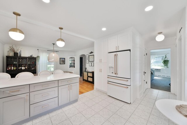 61412 Walnut St, Cassopolis, MI 49031 - kitchen with recessed lighting, gray cabinets, arched walkways, high end white refrigerator, and decorative light fixtures