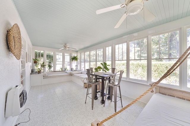 61412 Walnut St, Cassopolis, MI 49031 - sunroom / solarium featuring baseboards, heating unit, and a healthy amount of sunlight