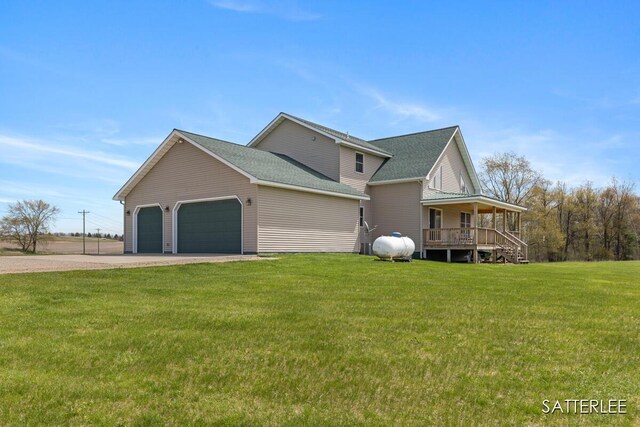 view of property exterior featuring a porch, roof with shingles, dirt driveway, a lawn, and a garage