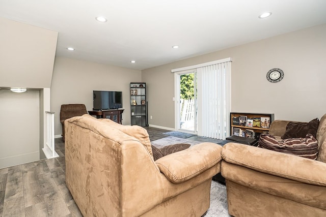 living area featuring recessed lighting, baseboards, and wood finished floors