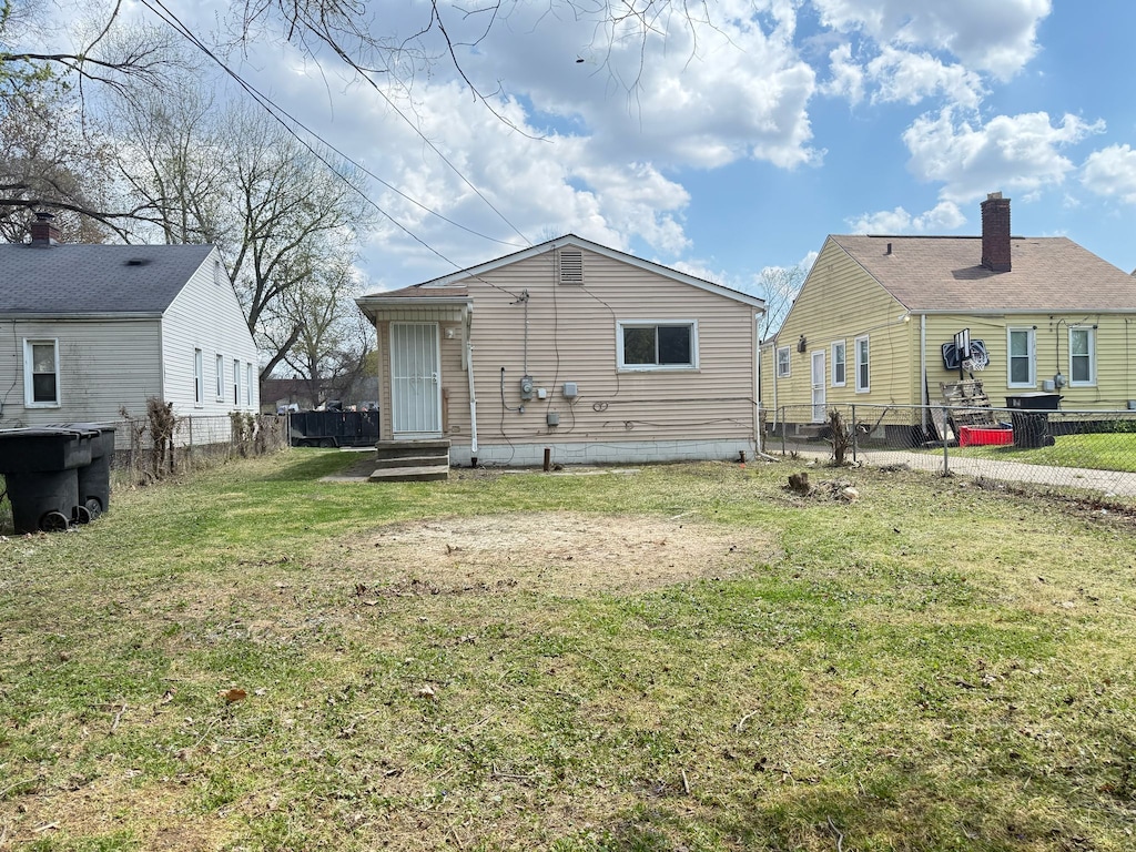 rear view of house featuring entry steps