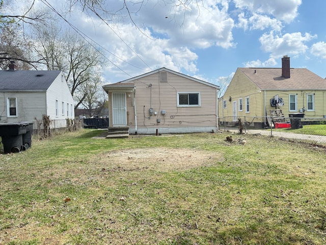 rear view of house featuring entry steps