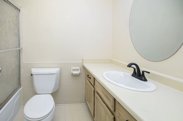 420 Baldwin Ave Unit 92, Rochester, MI 48307 - bathroom with tile walls, tile patterned flooring, vanity, a wainscoted wall, and toilet