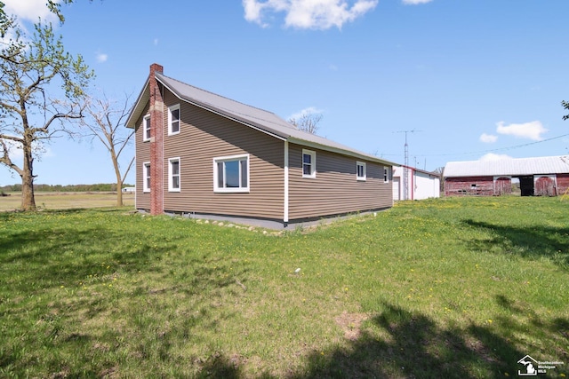13280 Burt Rd, Pittsford, MI 49271 - exterior space featuring a lawn and a chimney