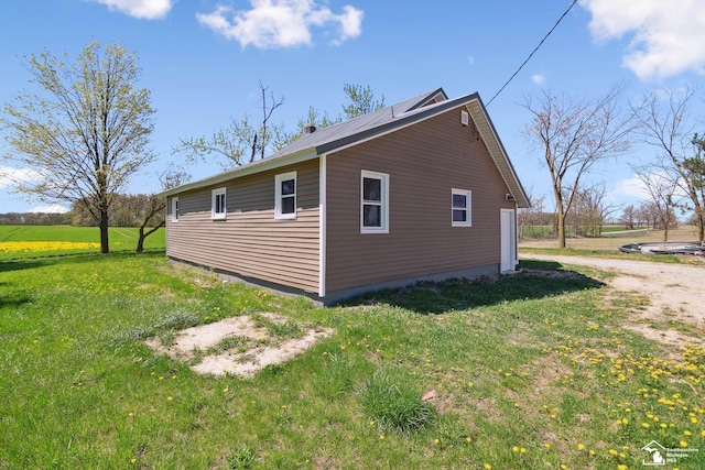 13280 Burt Rd, Pittsford, MI 49271 - view of side of property with a yard