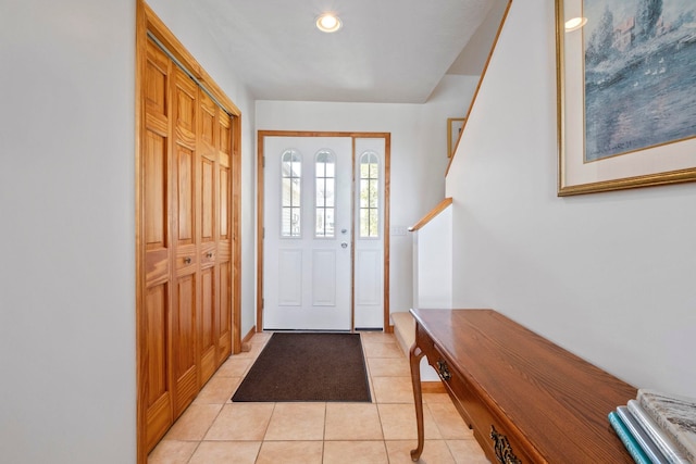 7734 N Shore Ct, Grawn, MI 49637 - entrance foyer featuring light tile patterned floors and recessed lighting