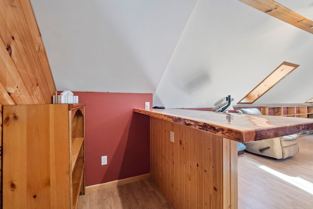 7734 N Shore Ct, Grawn, MI 49637 - bonus room featuring wood finished floors and vaulted ceiling