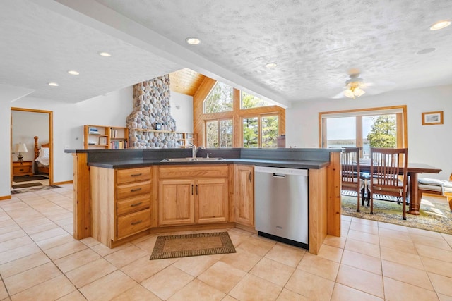7734 N Shore Ct, Grawn, MI 49637 - kitchen featuring dark countertops, a sink, dishwasher, recessed lighting, and vaulted ceiling