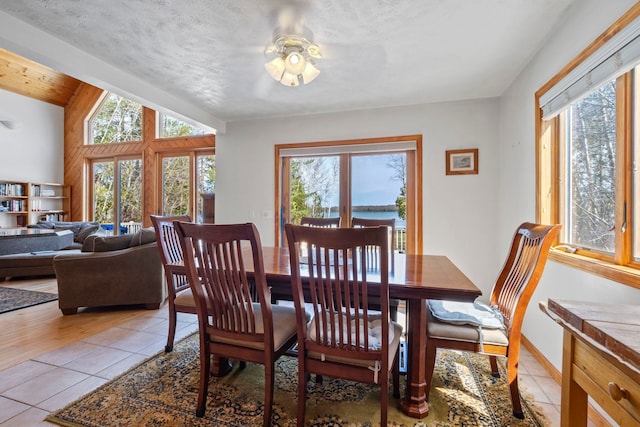 7734 N Shore Ct, Grawn, MI 49637 - dining space featuring light tile patterned floors