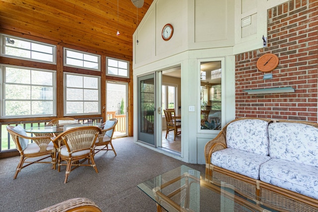 sunroom / solarium with french doors, high vaulted ceiling, wood ceiling, and carpet