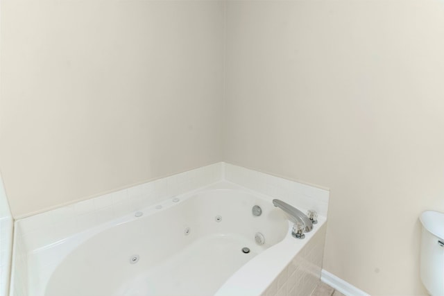 full bathroom featuring a tub with jets