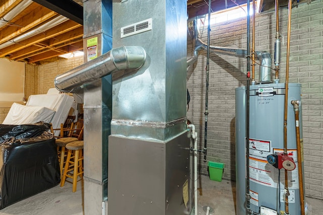 utilities featuring heating unit and gas water heater