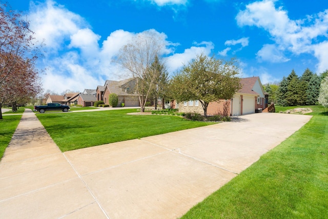 view of front facade with concrete driveway, an attached garage, a residential view, and a front lawn