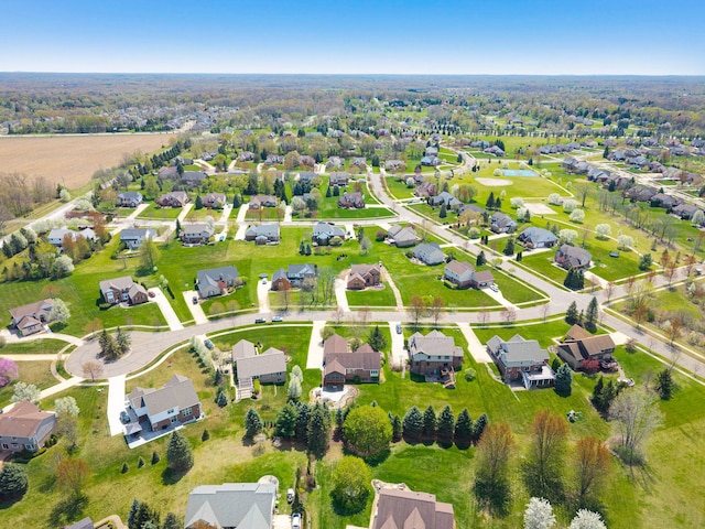 bird's eye view featuring a residential view and a water view