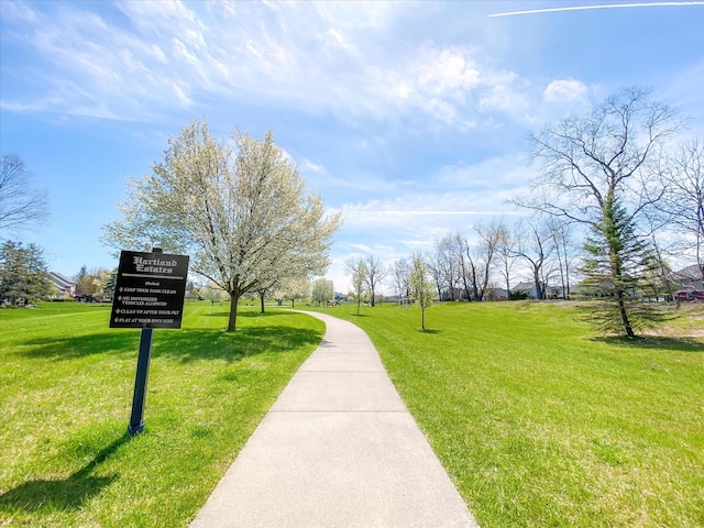 view of home's community featuring a lawn
