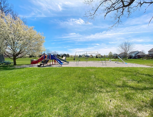 communal playground featuring a yard