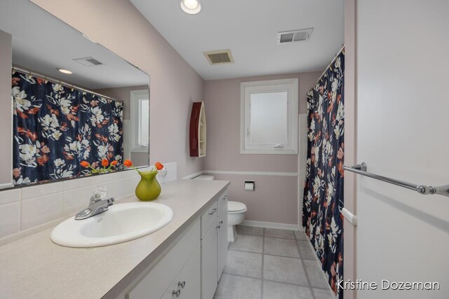 full bath with visible vents, toilet, and vanity