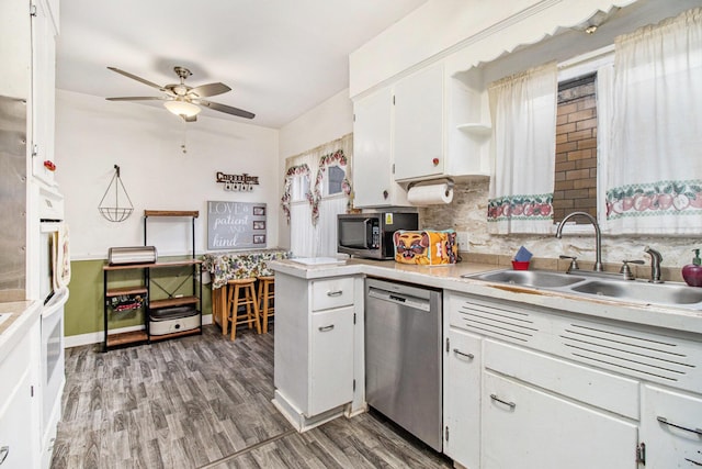 kitchen featuring a sink, light countertops, white cabinetry, a ceiling fan, and appliances with stainless steel finishes