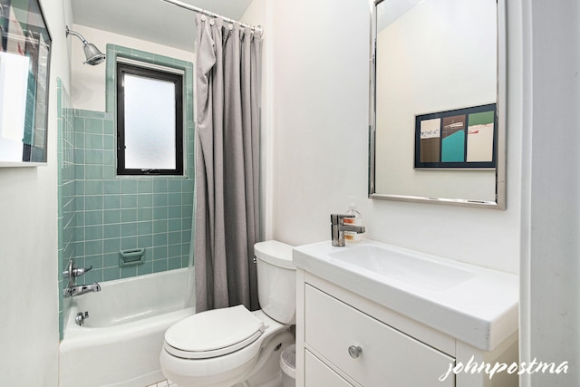 bathroom featuring vanity, shower / tub combo with curtain, and toilet